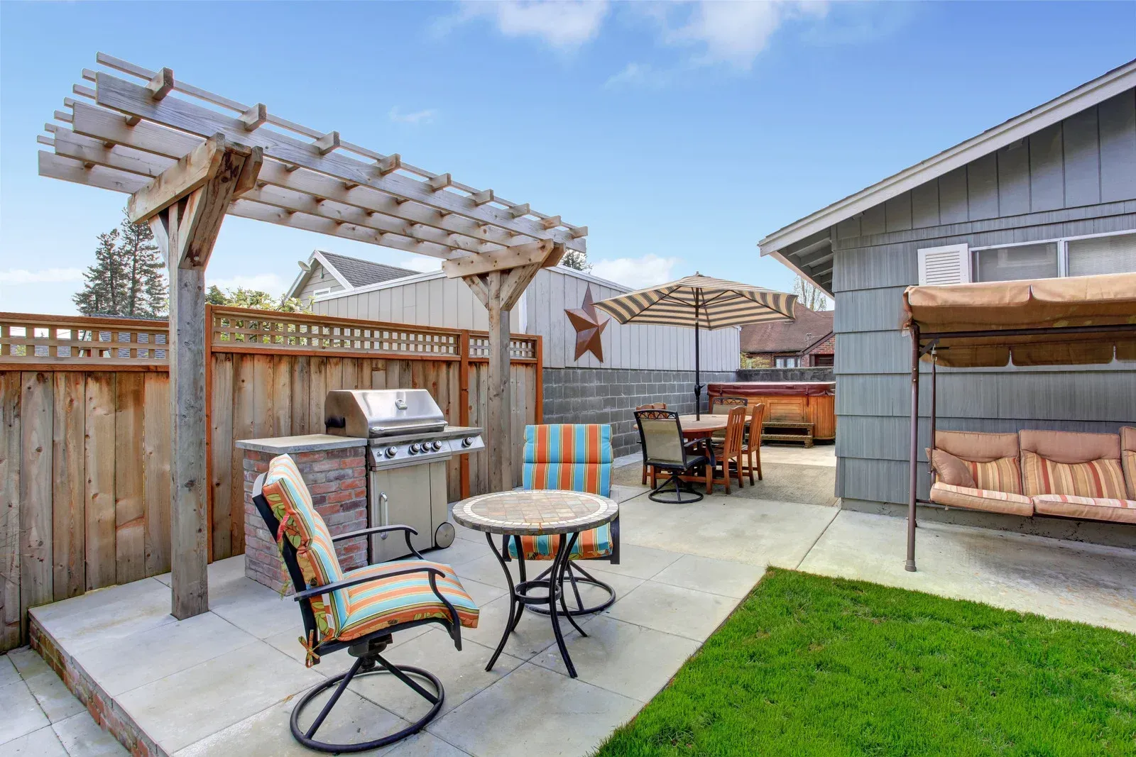 Man inspecting an AC unit with a flashlight outdoors. White siding, a window, and trees are in the background.