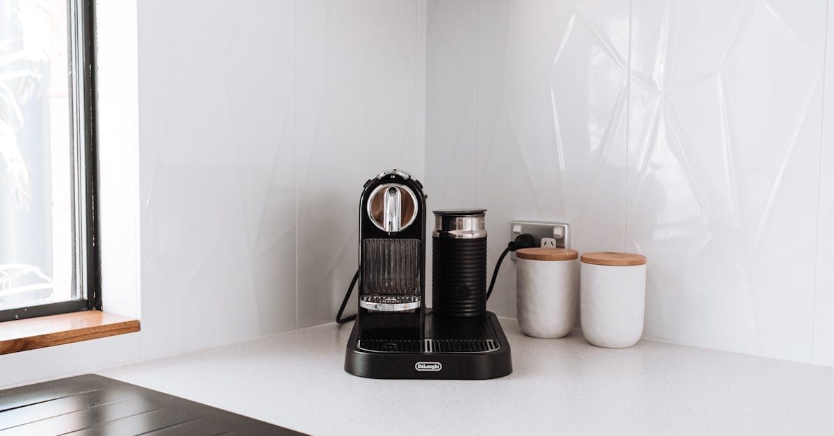 A Coffee Maker is Sitting on a Counter Next to a Window — Affordable Plumbing In Port Macquarie, NSW