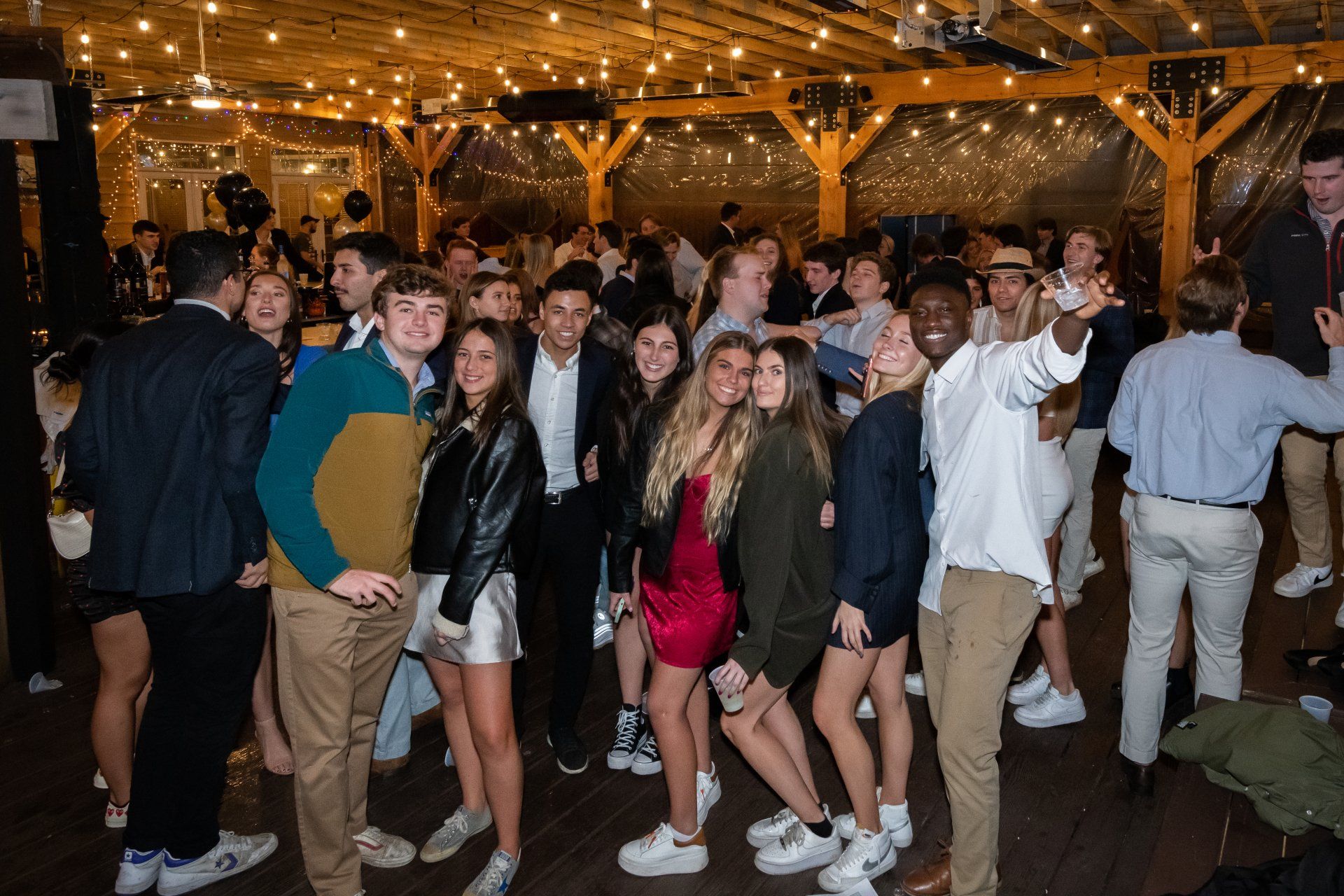 A group of people are posing for a picture at a party.