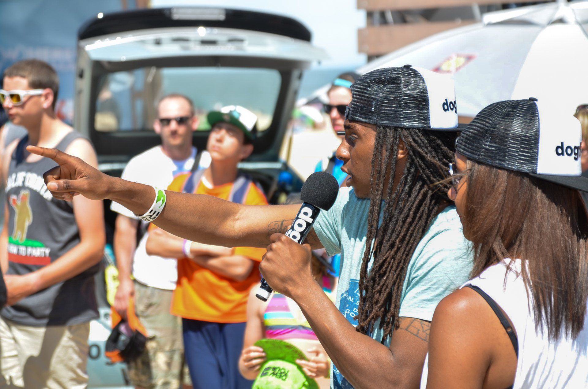 A group of people wearing hats with the word dog on them