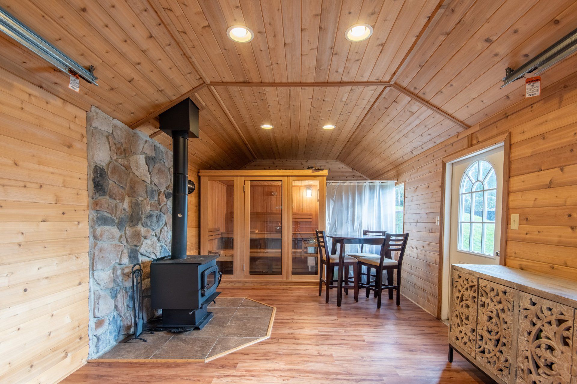 There is a wood stove in the middle of the room.