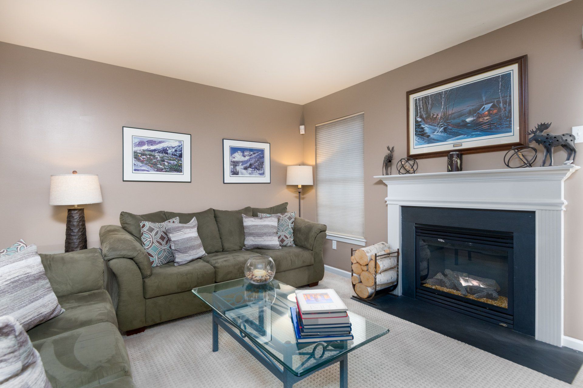 A living room with a fireplace and a couch