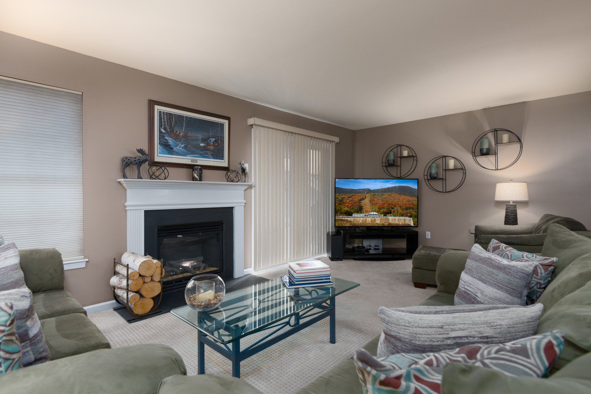 A living room filled with furniture and a fireplace.