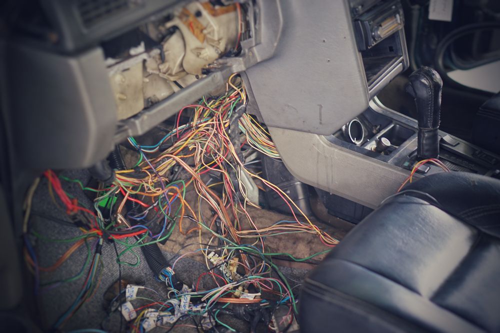 Tangled Car Wiring Exposed Under the Dashboard — Mechanic in Boronia Heights, QLD