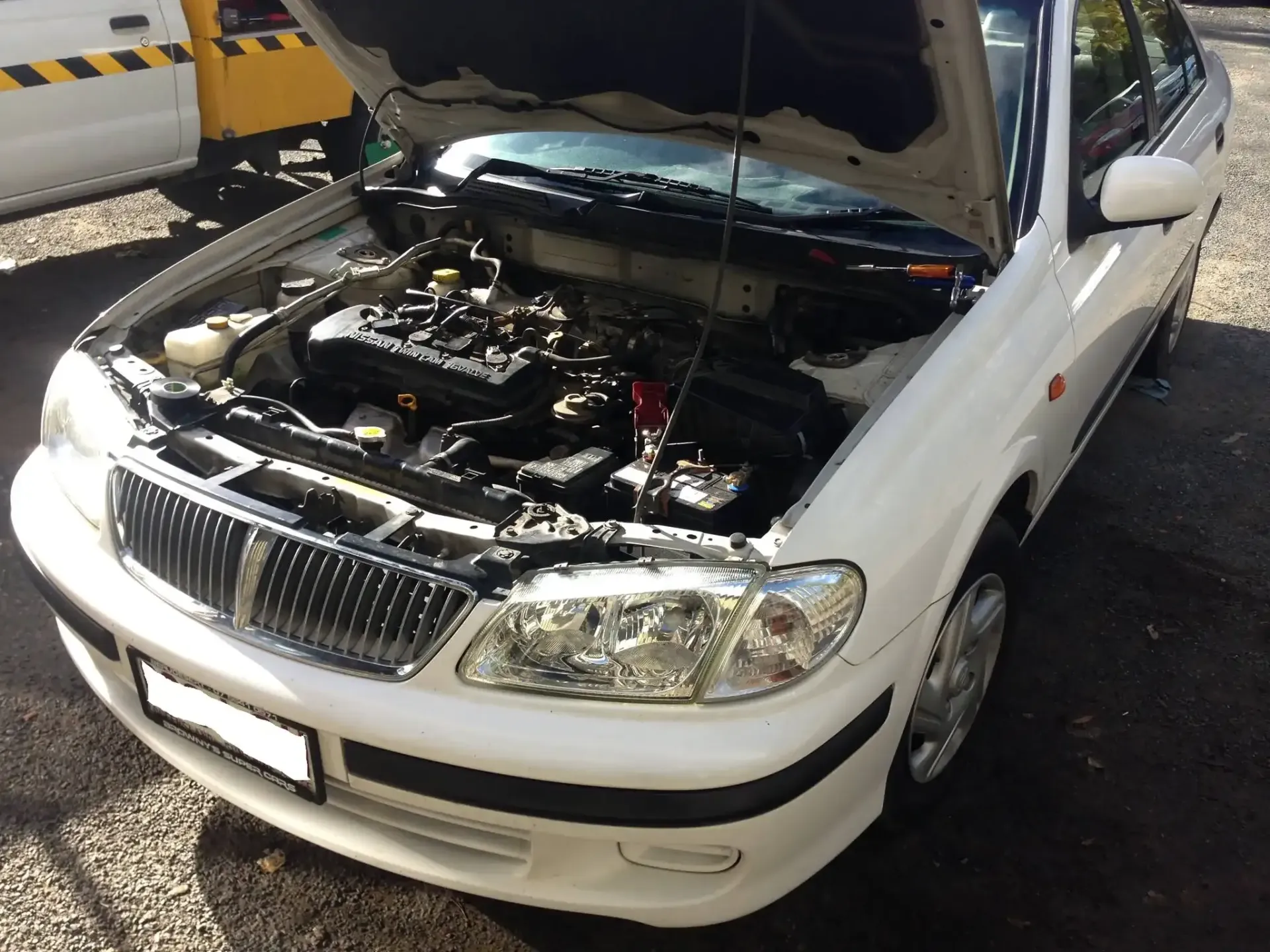 White car with open hood, engine visible. — Mechanic in Regents Park, QLD