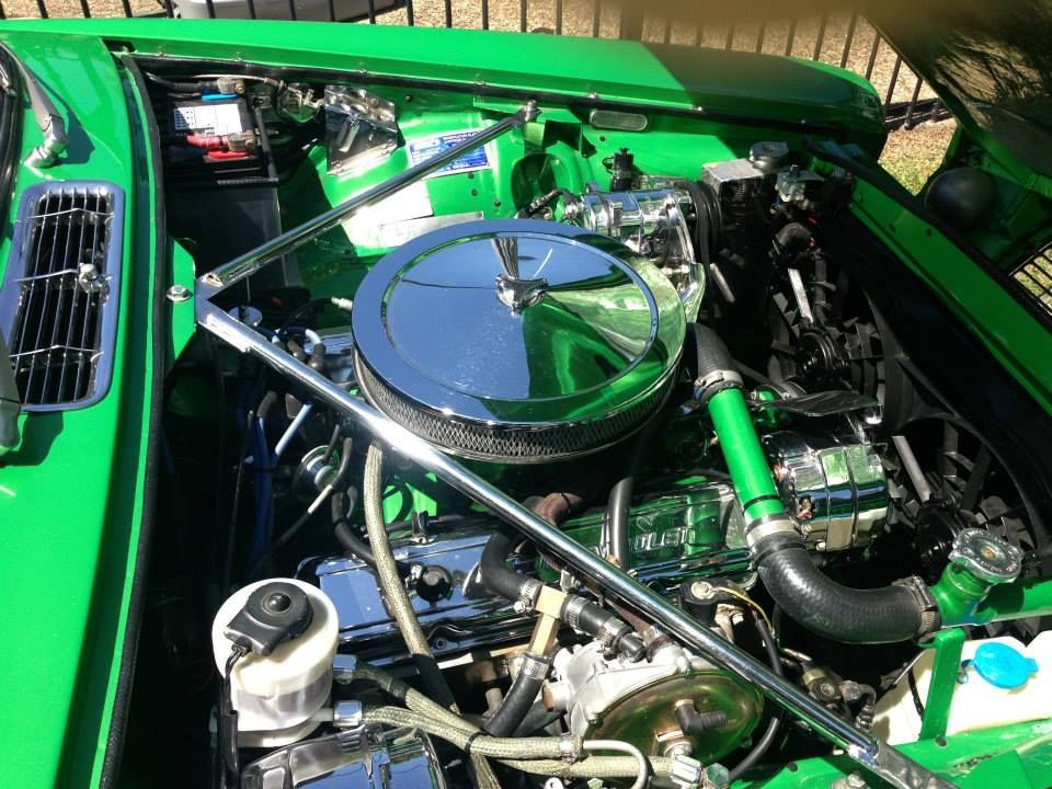 Green car engine compartment with chrome and polished parts. — Mechanic in Park Ridge, QLD