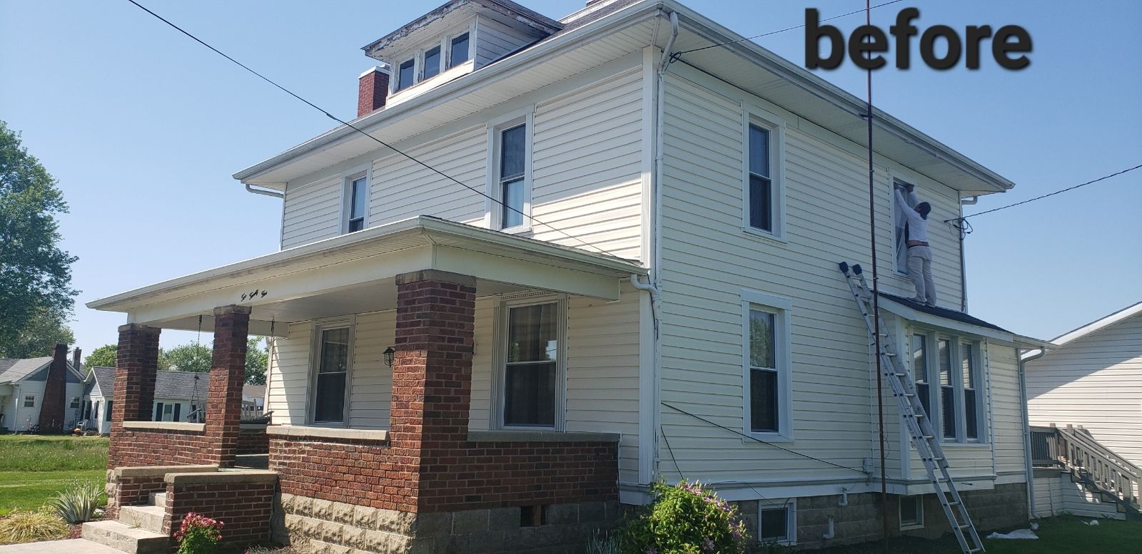 White house with a brick porch and a ladder, labeled 