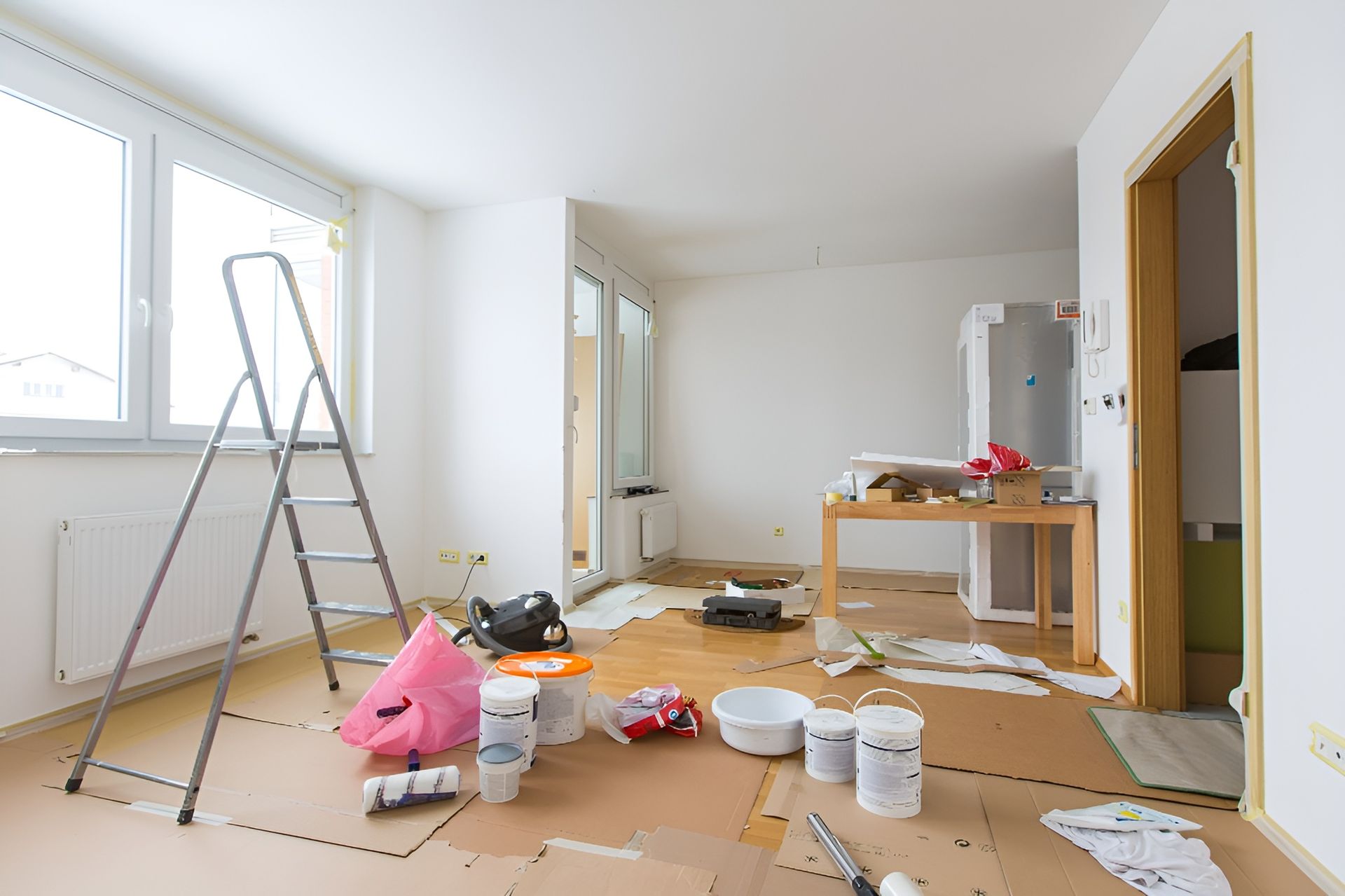 Room Interior Under Renovation with Tools, Paint, and Protective Flooring — Frenchy’s Plaster & Paint in Palmerston, NT