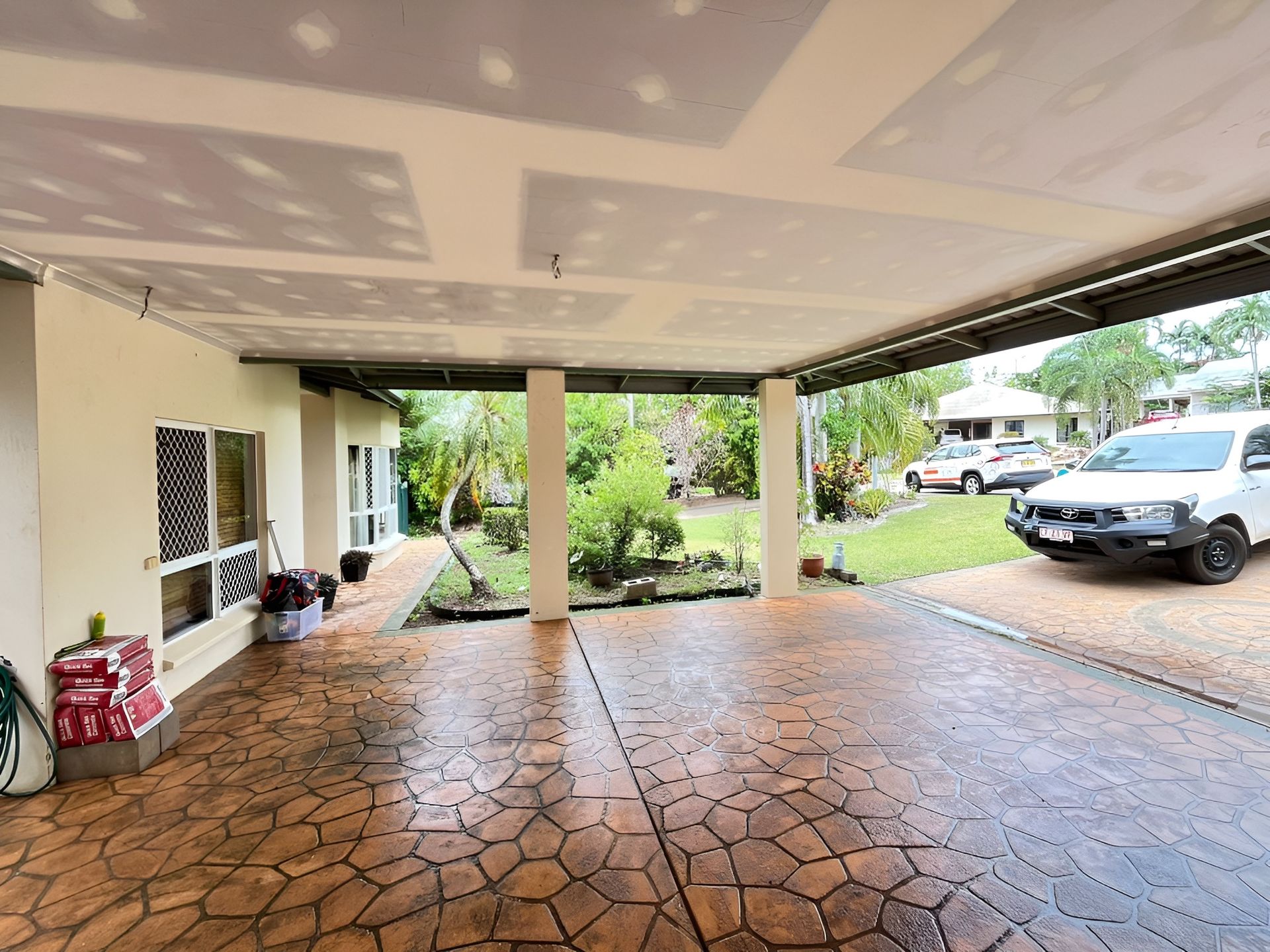 Covered Patio with Textured Concrete Floor — Frenchy’s Plaster & Paint in Bellamack, NT