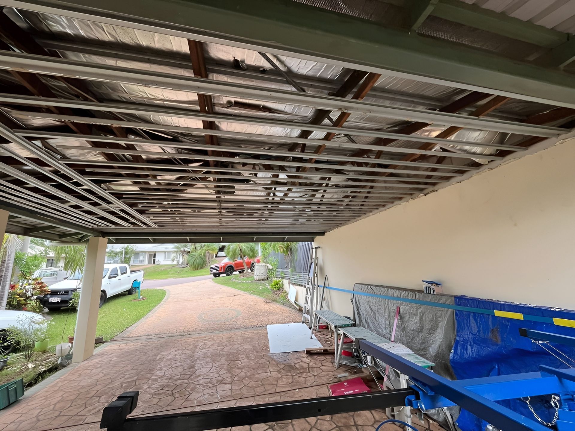 Underside of A Carport Roof with Exposed Framing and Insulation — Frenchy’s Plaster & Paint in Bellamack, NT