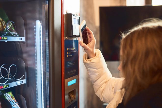 A vending machine filled with bags of doritos and other snacks.
