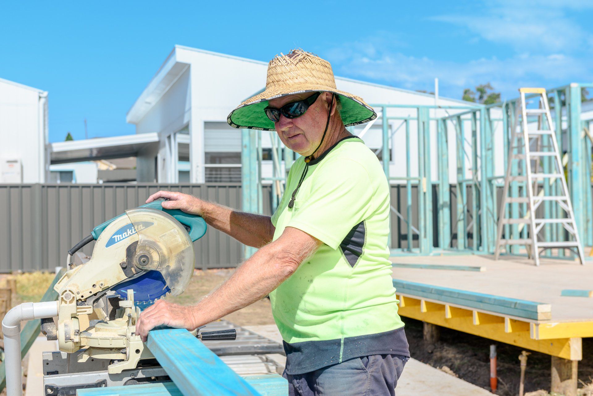 person cutting metal beam