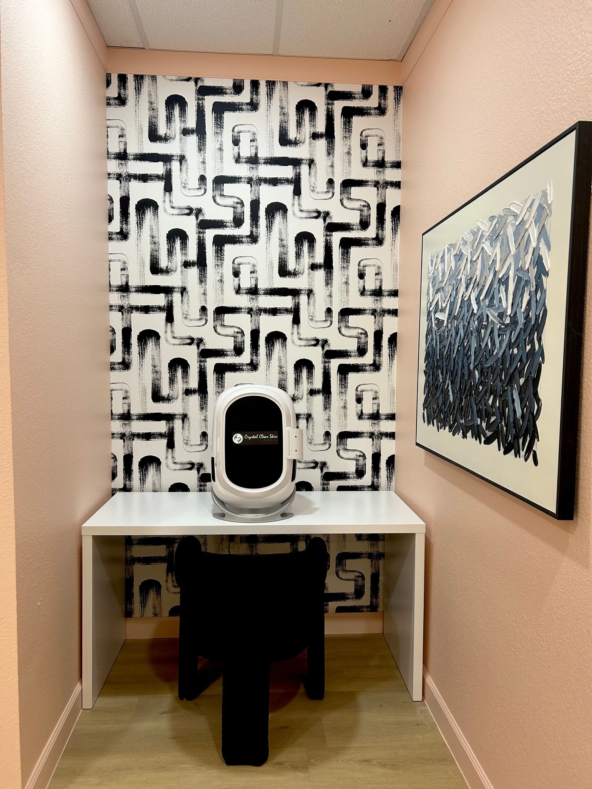 A small room with a maze pattern on the wall
