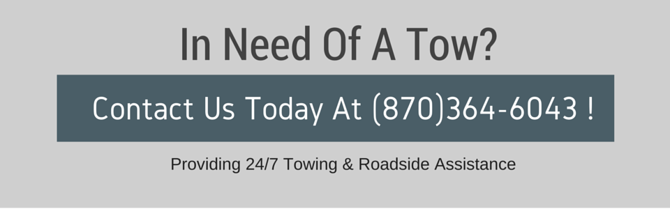 Advertisement for towing services with phone number.