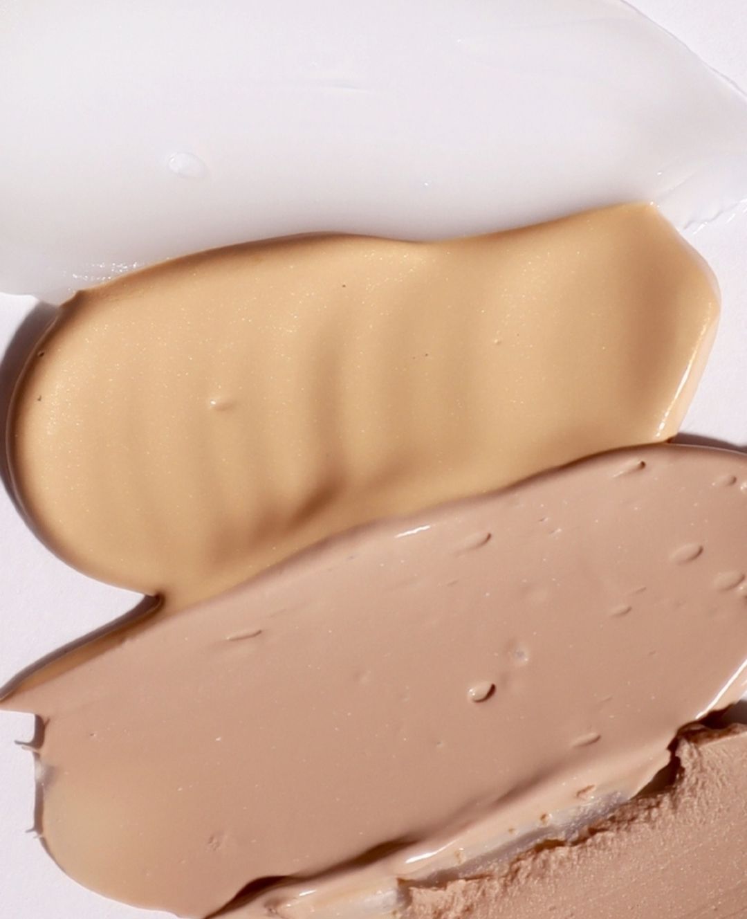 A Close Up of Two Different Shades of Foundation on a White Surface — Gorjess Aesthetics in Corrimal, NSW