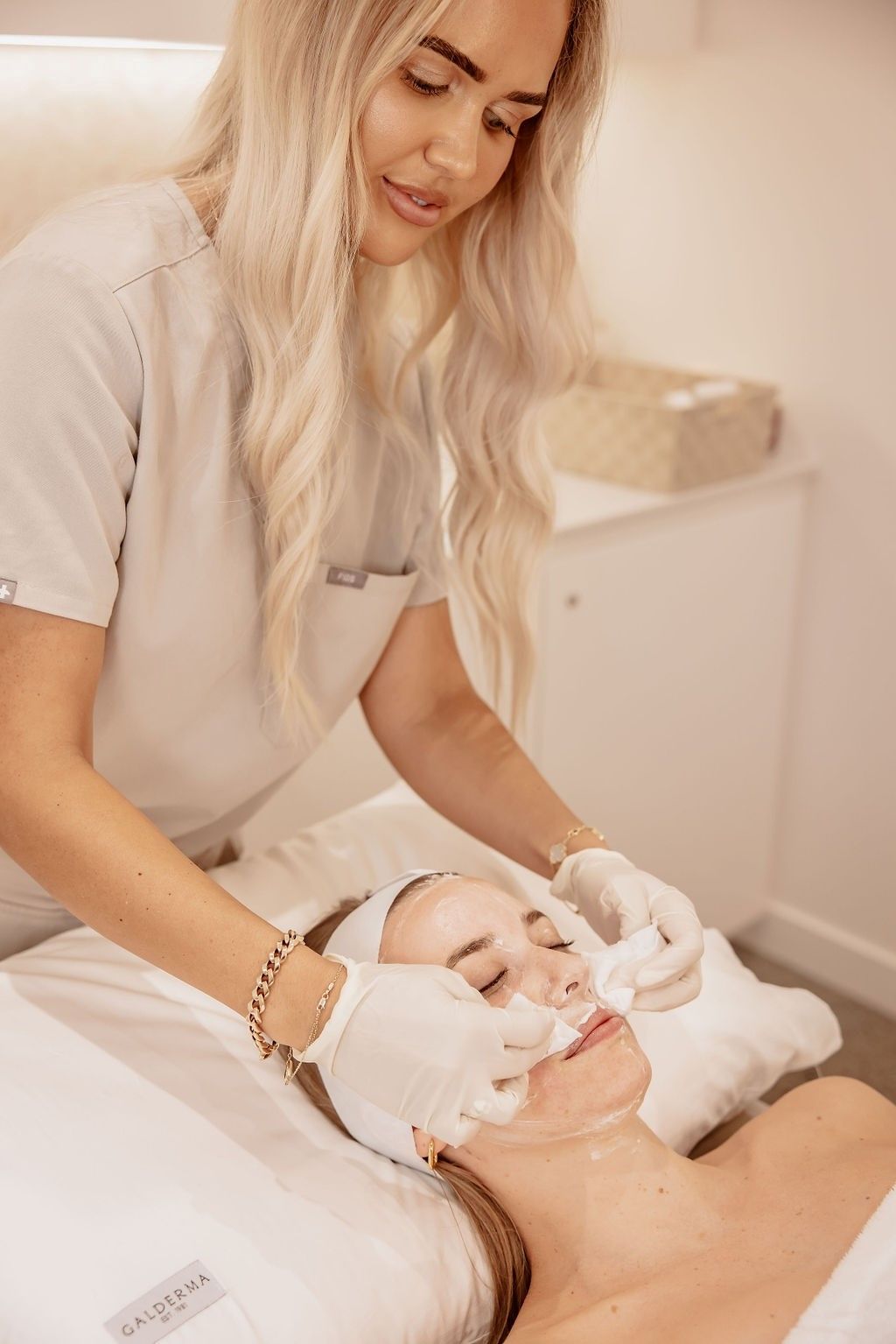 A Woman is Getting a Facial Treatment at a Spa — Gorjess Aesthetics in Corrimal, NSW
