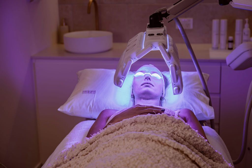 A Woman is Getting a Facial Treatment at a Spa — Gorjess Aesthetics in Corrimal, NSW