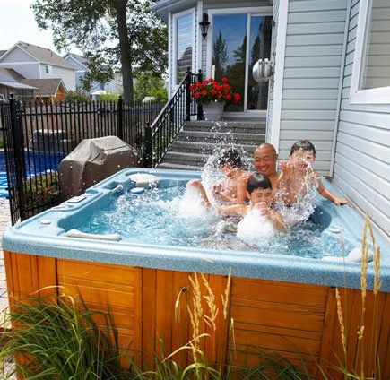 Father and Kids in Hot Tubs — Portage, MI — Michigan Swim Pool & Spa
