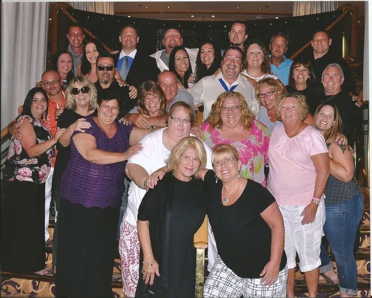 A large group of people are posing for a picture