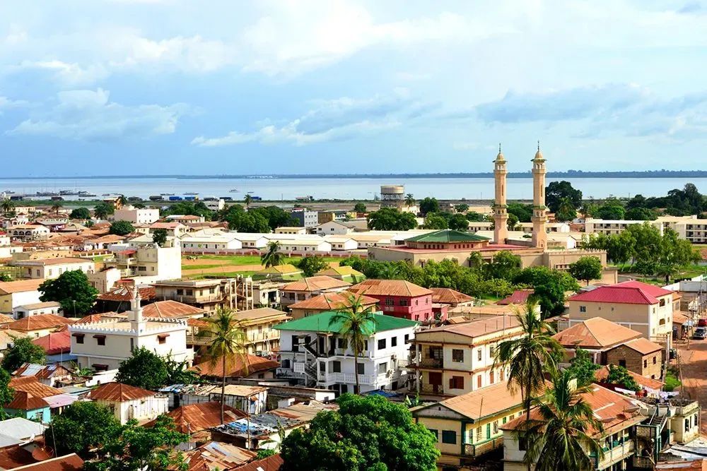 An aerial view of a city with a lake in the background.