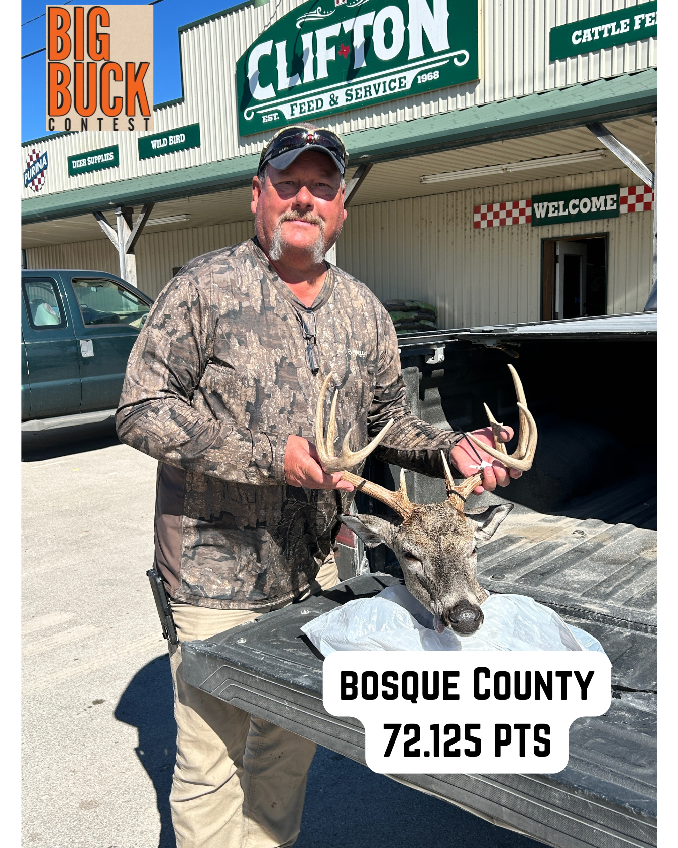 Man holding a deer's head with antlers in front of Clifton store. Score: 72.125 pts in Bosque County.