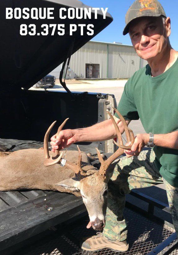 Man holds deer antlers in Bosque County, Texas; score 83.375 points.