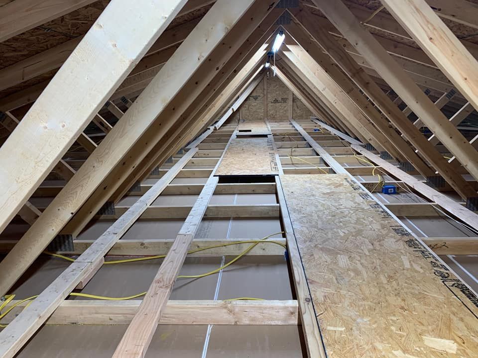 looking up at the roof of a building under construction .