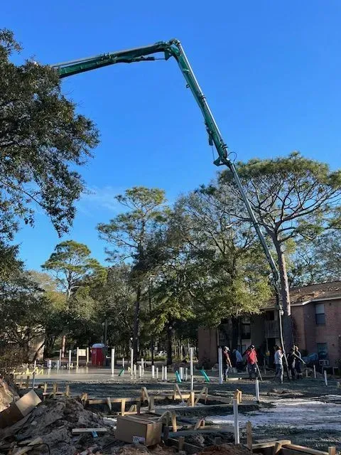 A concrete pump is being used on a construction site