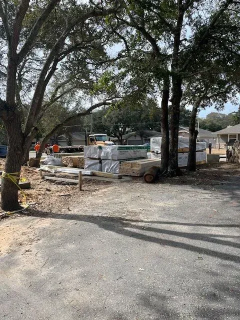 A construction site with a lot of boxes on the ground.