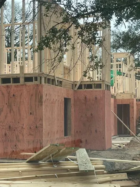 A house is being built with plywood walls