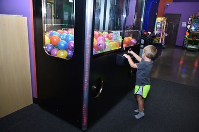 Playing On The Arcade Area Machines — Liberty, MO — Fun Run