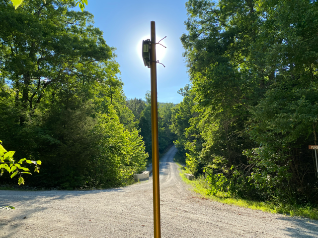 Image of an acoustic detector facing down a road corridor.