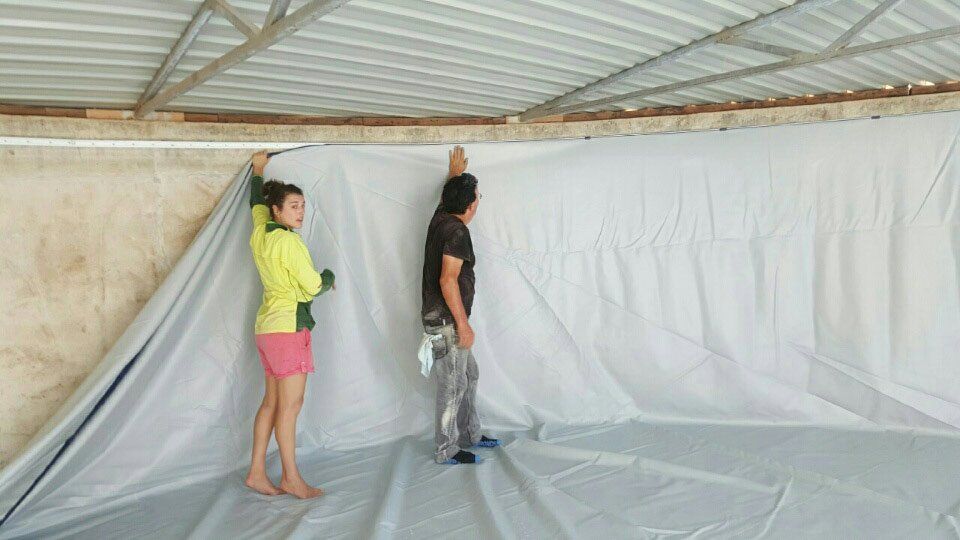 putting up liner inside water tank