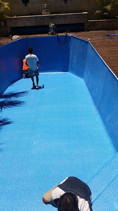 person walking on bottom of pool