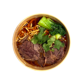 A bowl of beef noodle soup with bok choy and cilantro in a brown paper bowl, seen from above.