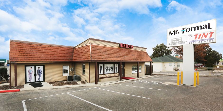 Mr. Formal clothing store exterior with red-tiled roof and parking lot sign at the entrance