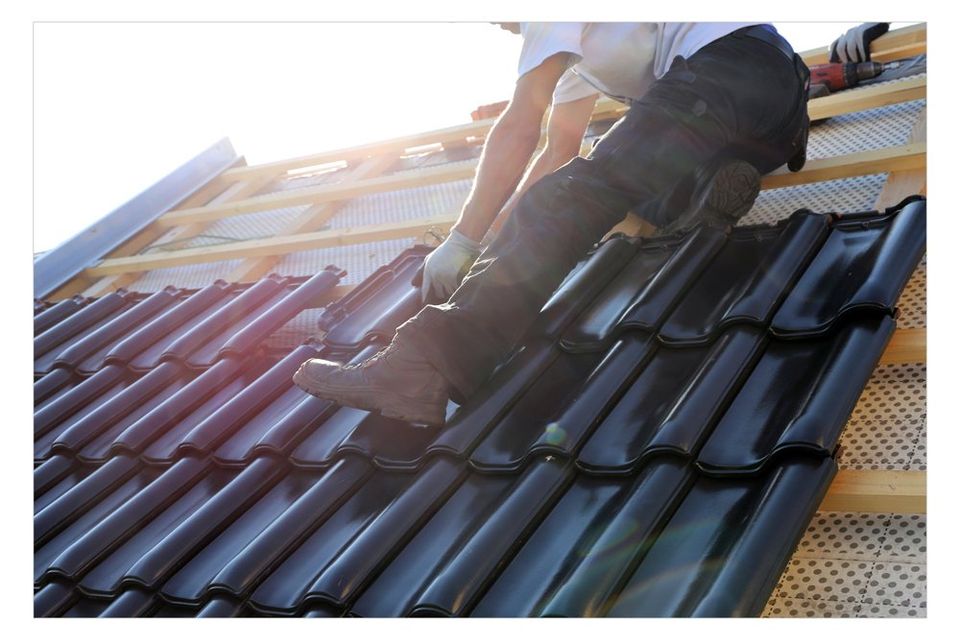  Econo-Roofing — Roofing Contractors Tiling A New Roof in Delhi, CA