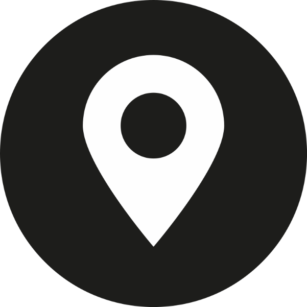 A white map pin in a black circle.