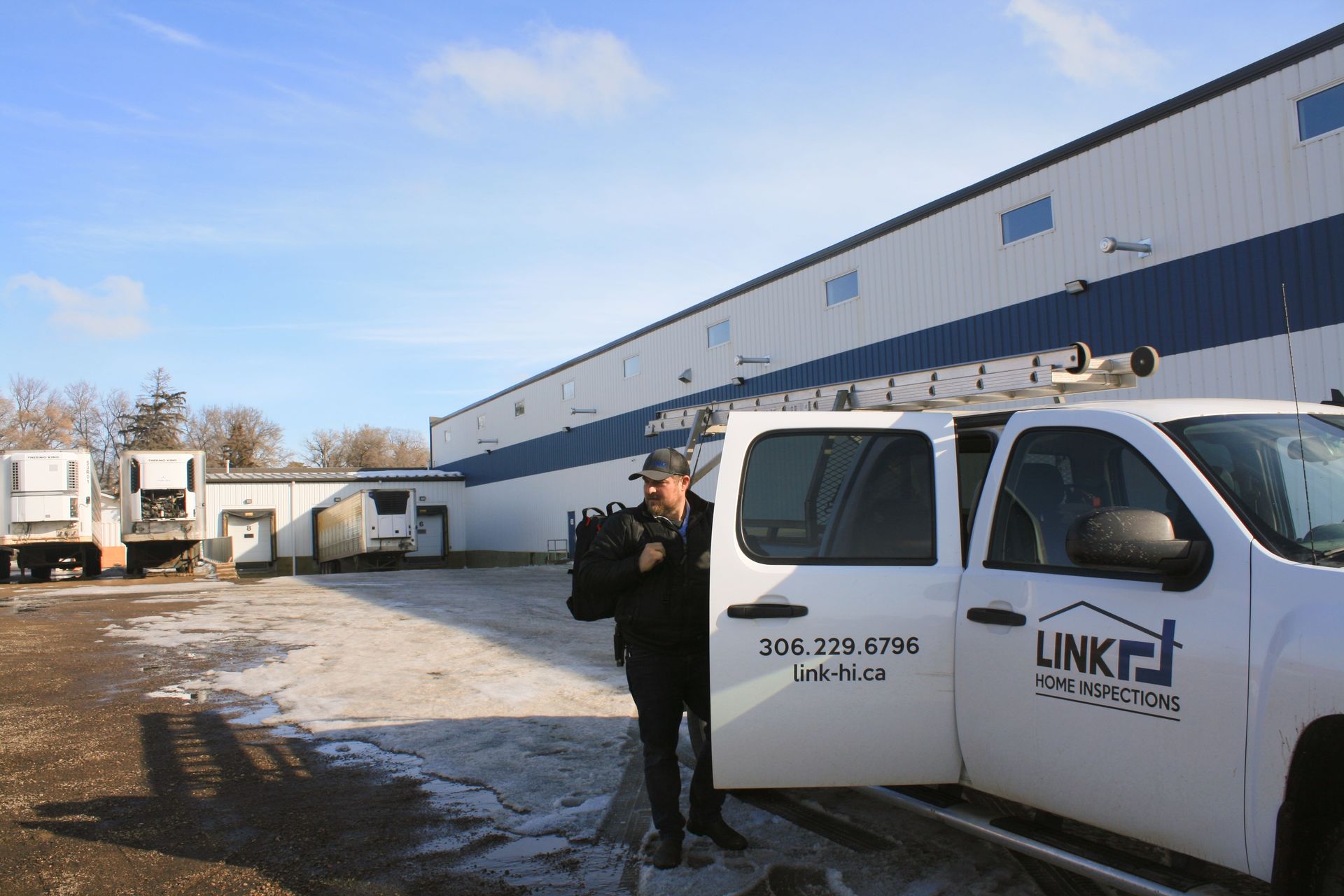 Certified inspector performing a commercial property inspection in Saskatoon.