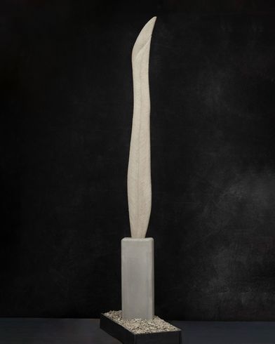 A tall white feather sculpture 