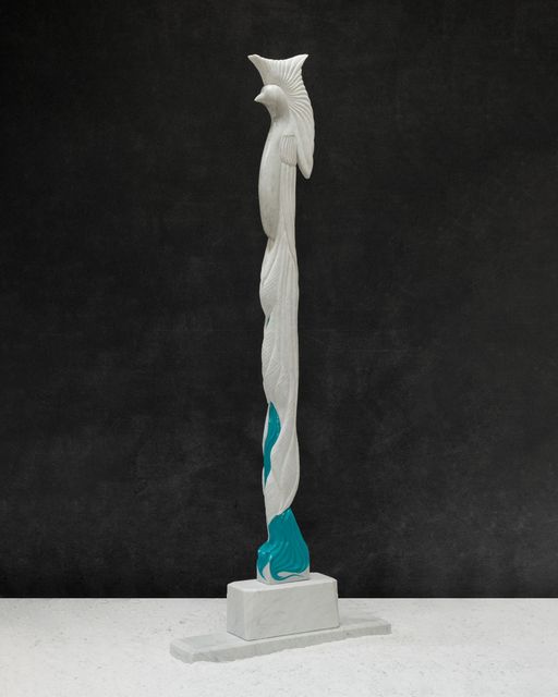 A white and blue statue of a bird