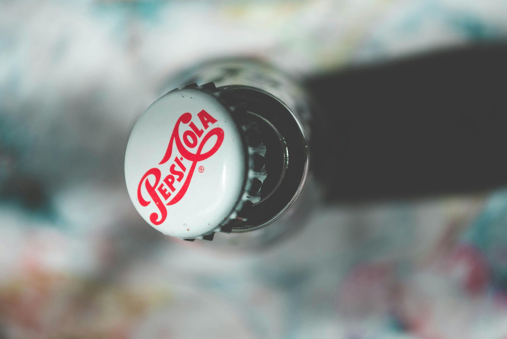 Close up shot of soda cap with pepsi-cola brand name