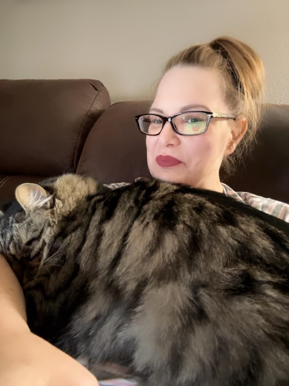 Burleson TX Realtor Jennifer Greenfield working from home with her cat assistant.