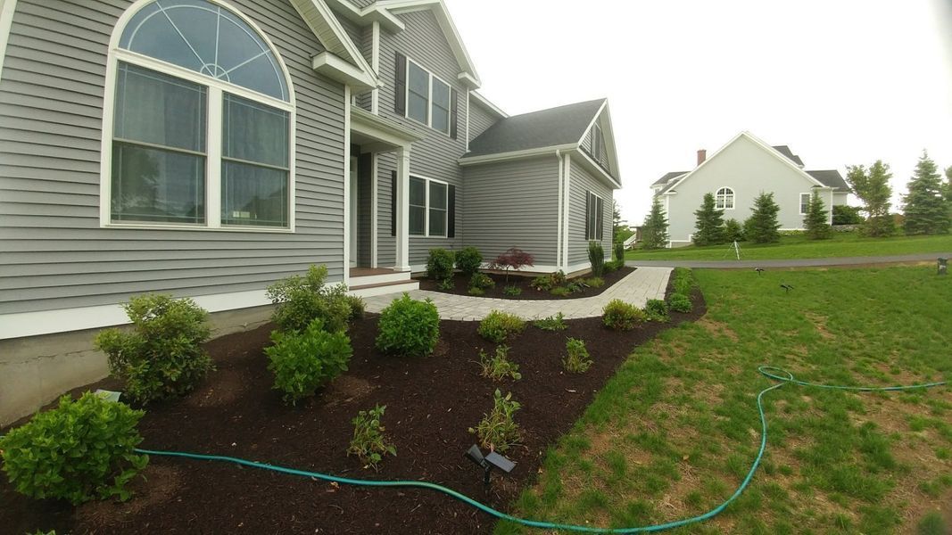 A large house with a hose in front of it.