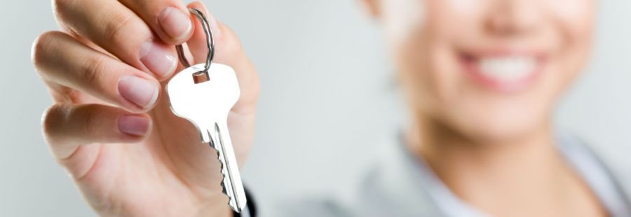 Girl holding key from a mobile locksmith in Adelaide