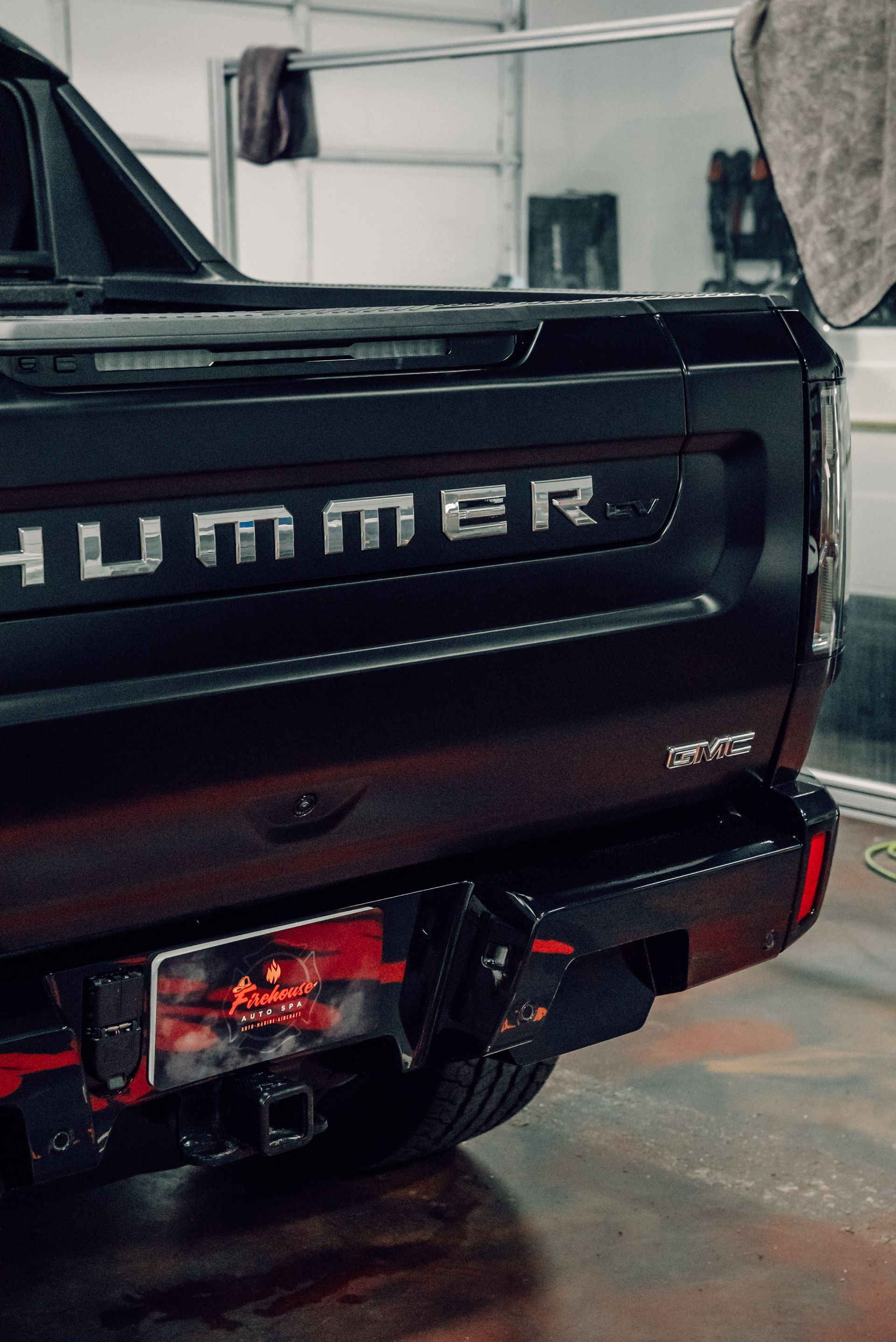 Black Hummer EV pickup truck's rear, with 