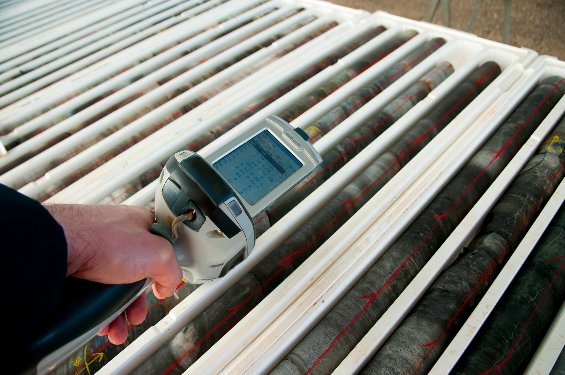 A person is holding a device that looks like a cell phone.