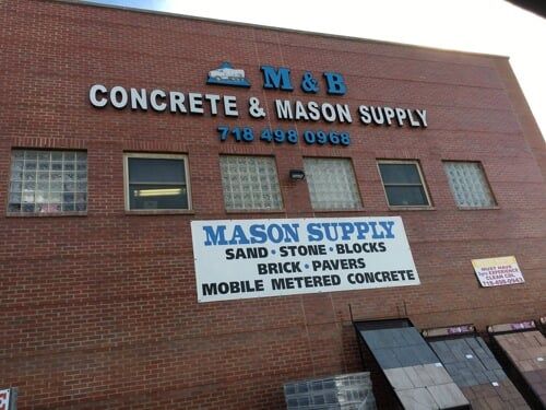 Brick building with signs for M&B Concrete & Mason Supply and Mason Supply.
