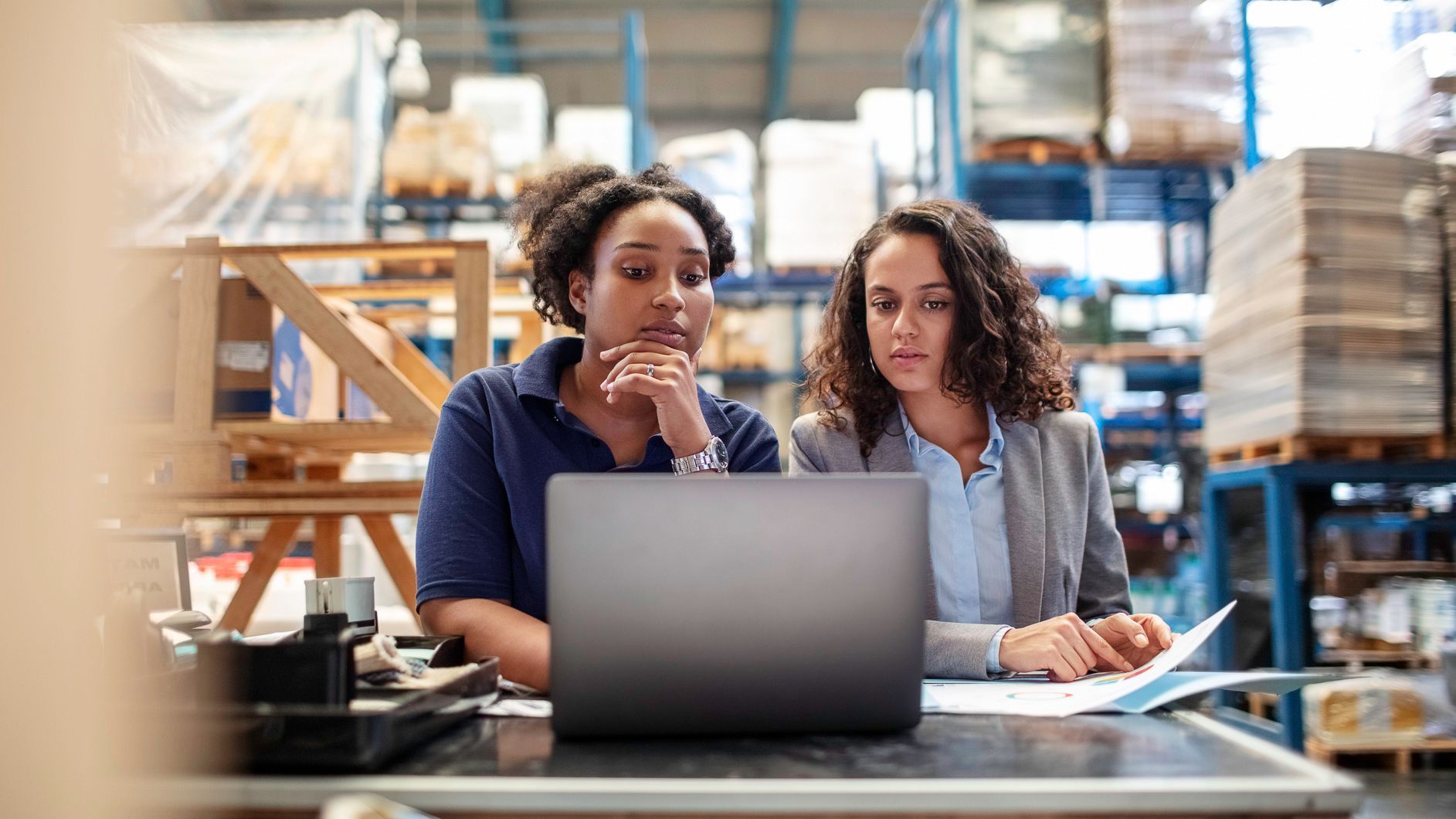 two employees discuss