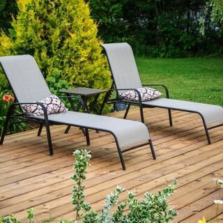 This is a picture of 2 sun loungers on a decking area in Leicestershire